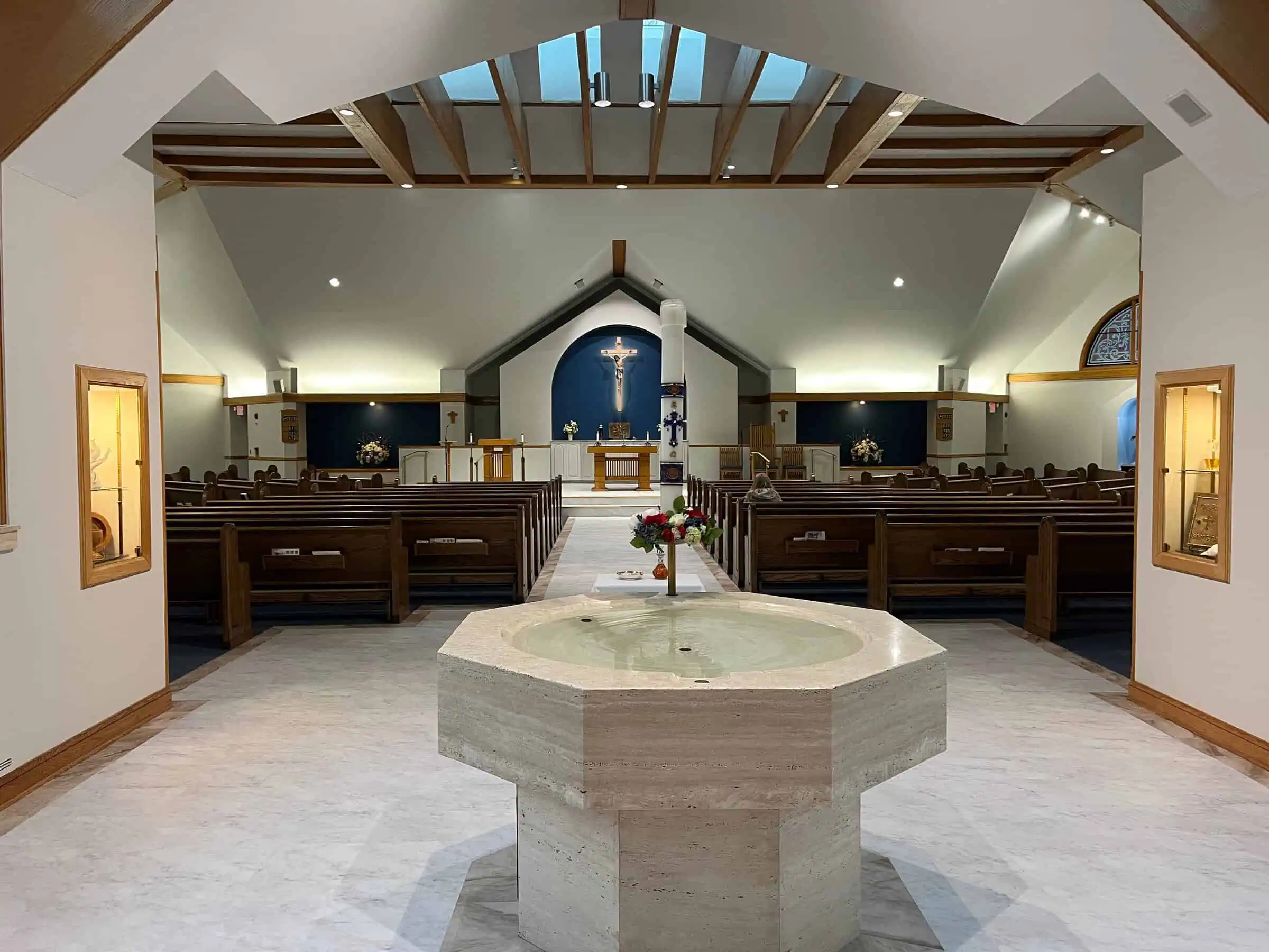 The renovated sanctuary of St. James, with refreshed lighting and original architectural detail
