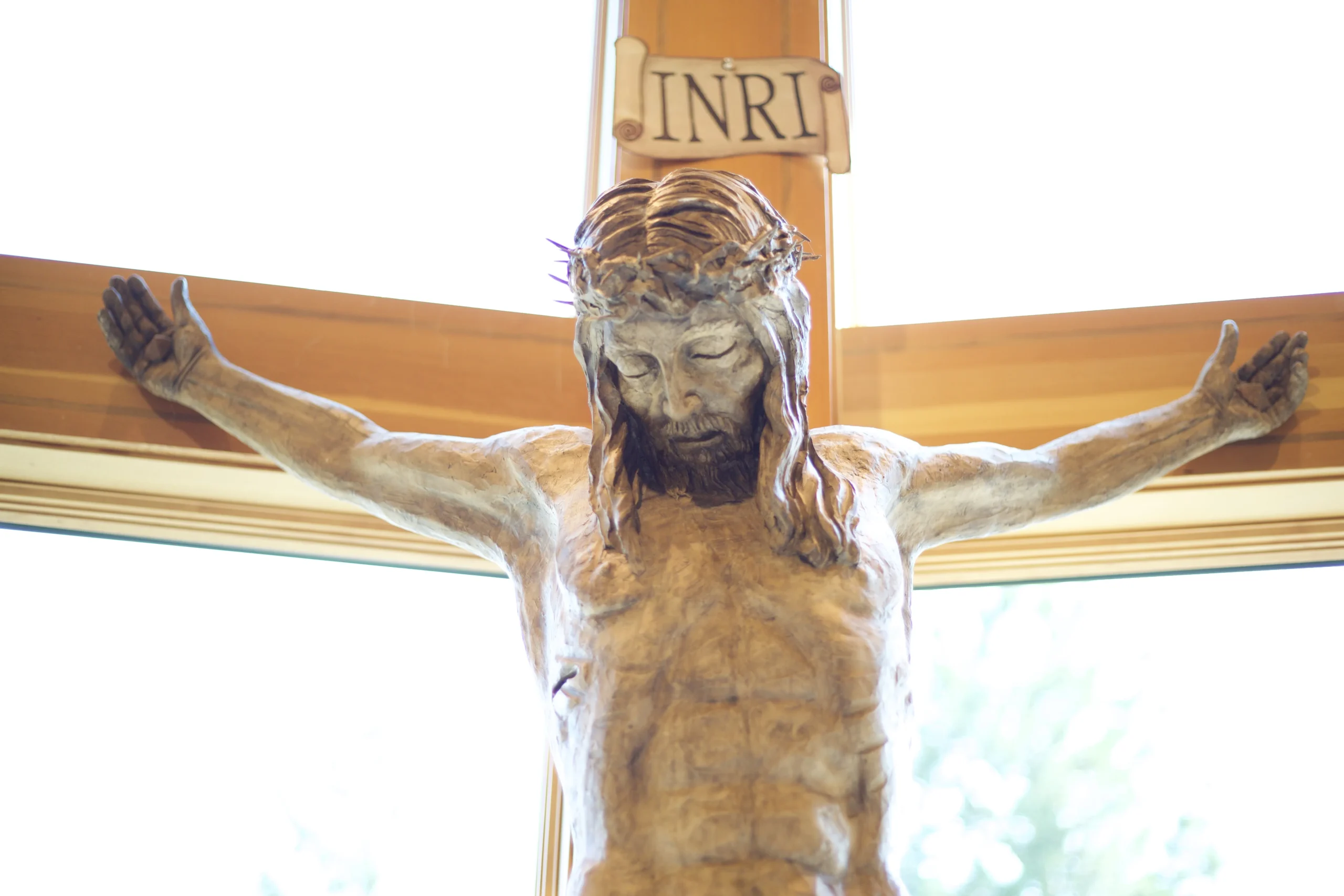 Wide shot of a crucifix in a chapel